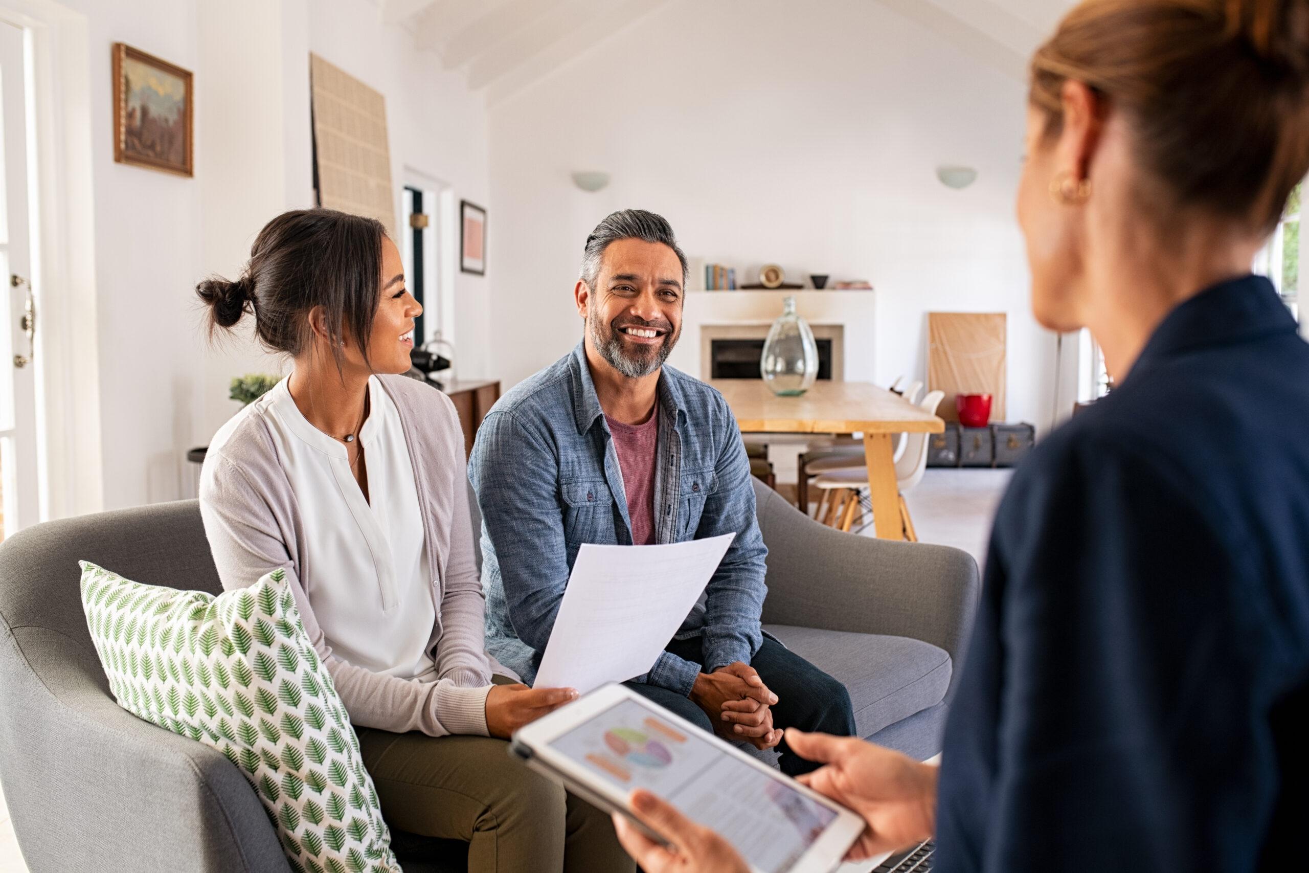 Couple Speaking with Financial Advisor at Home